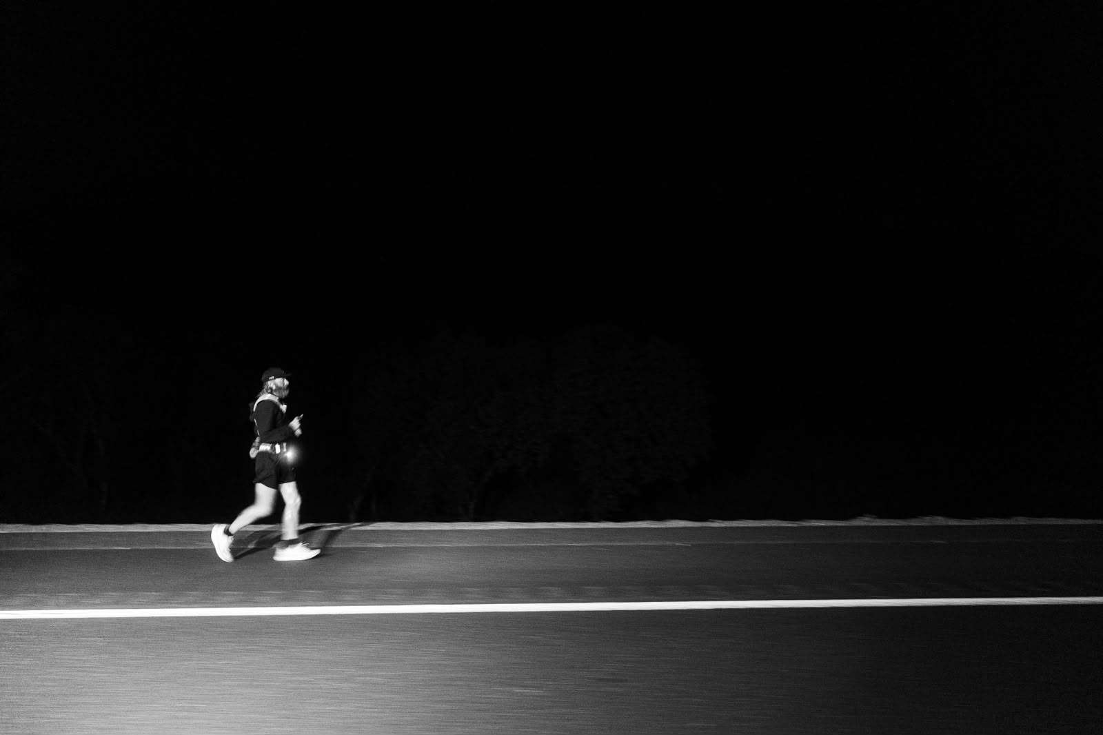 Cameron running at night on the road
